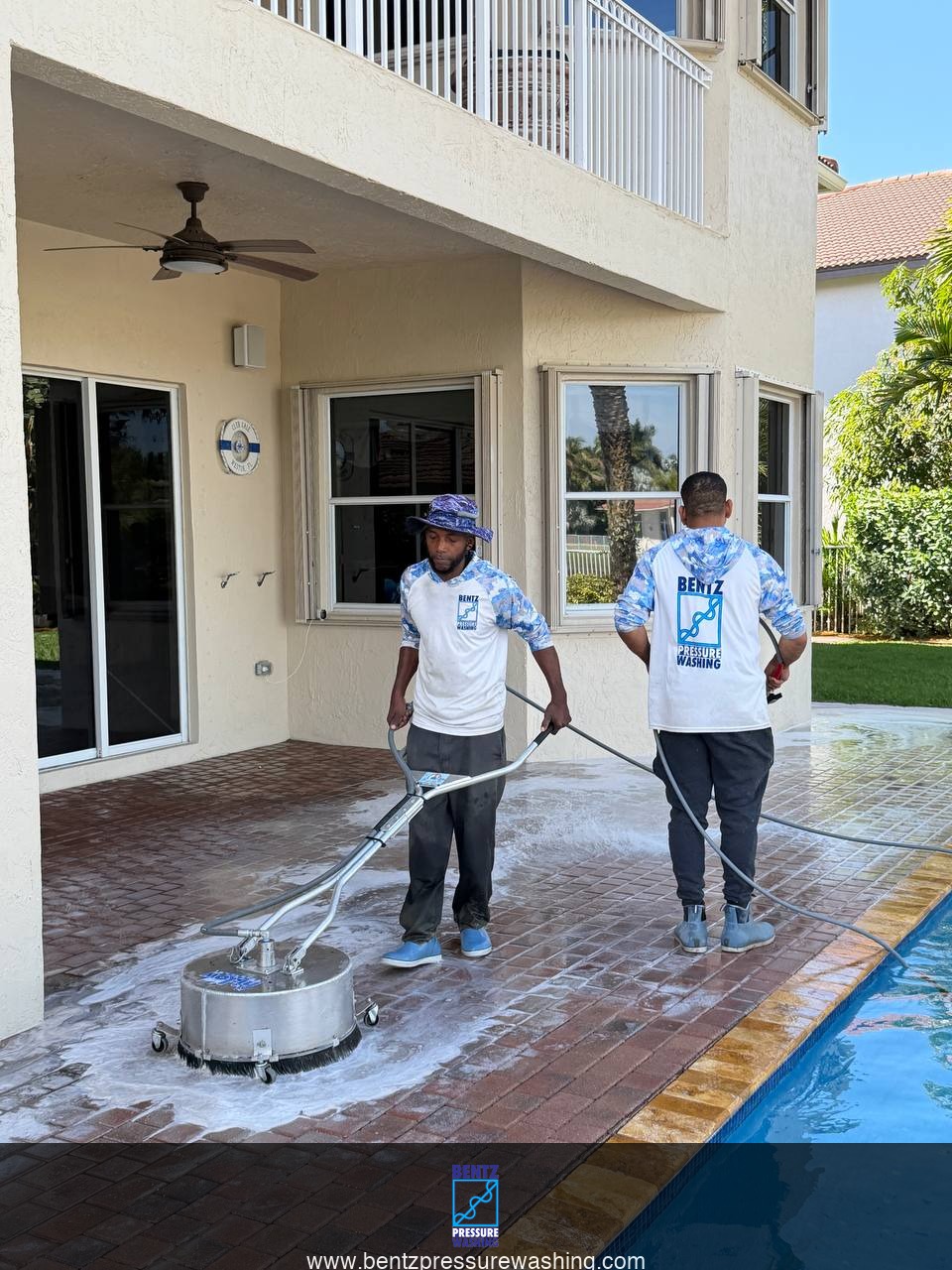 Bentz Pressure Washing crew using surface cleaner on pool deck pavers